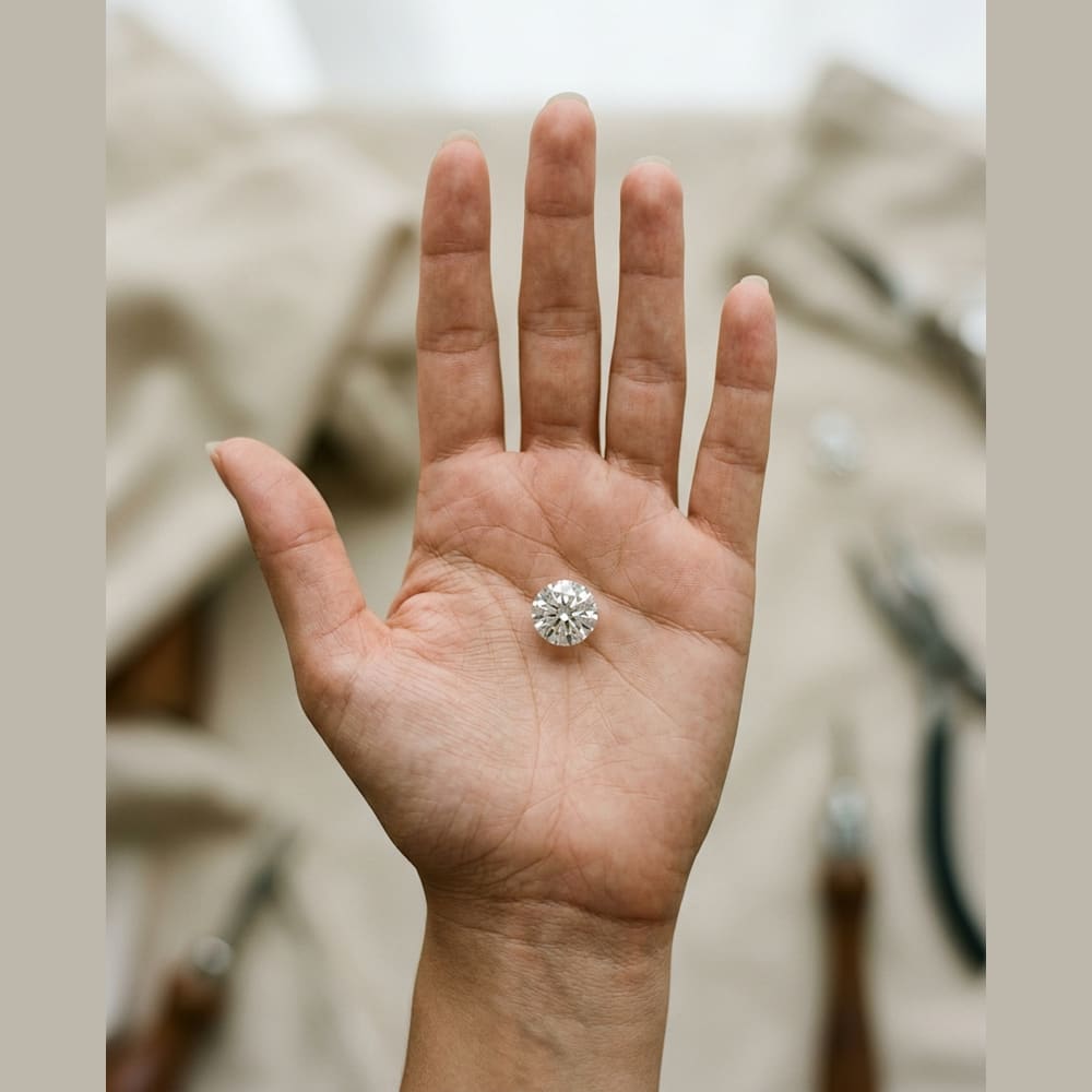 2 Carat Round Lab Grown Diamond, true-scale on open palm