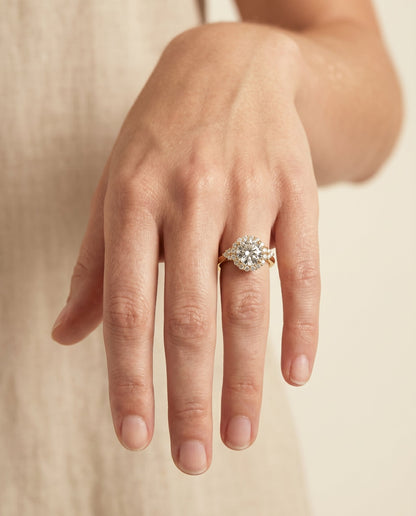 Kai Select Scroll Gallery Halo Round Lab Diamond Engagement Ring in 18K Yellow Gold, shown on hand | RockHer