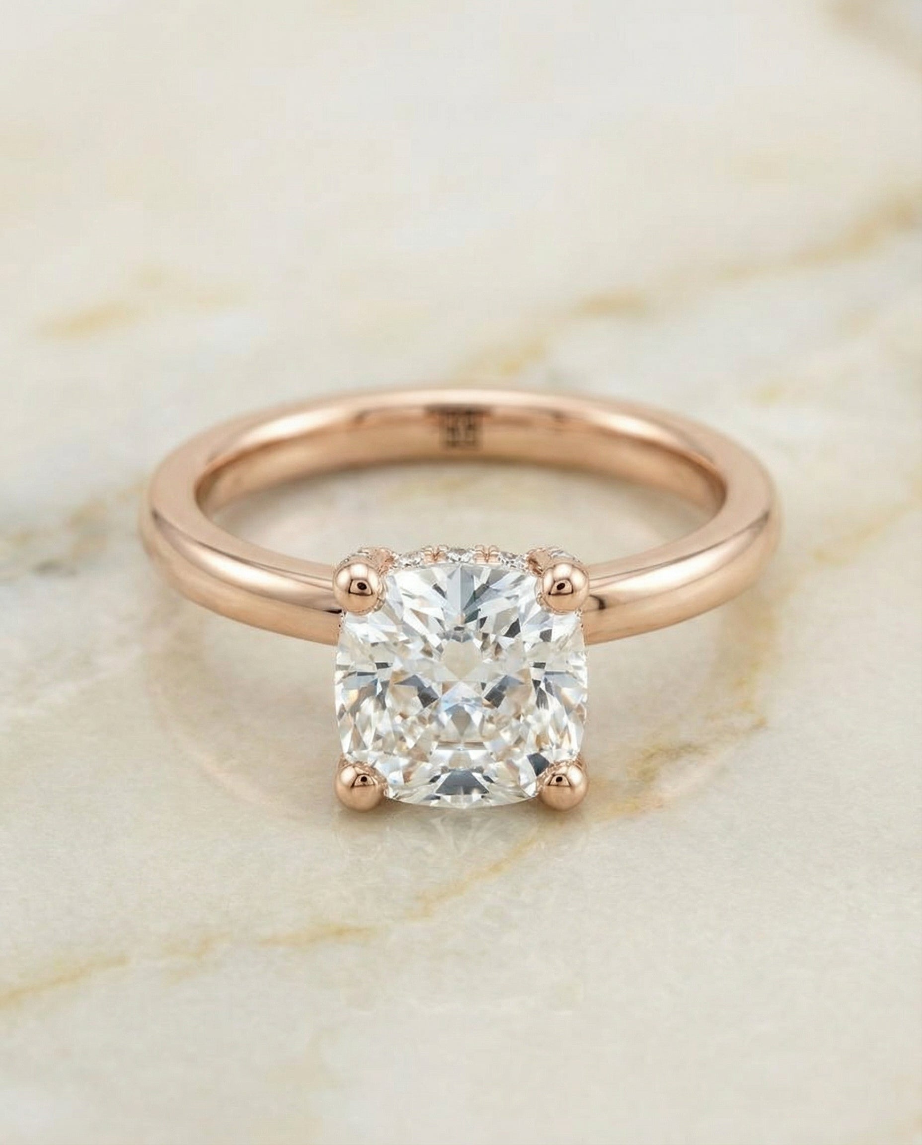 Secret Halo Adorned Prong Solitaire Cushion, in 14K Rose Gold – angled view | RockHer