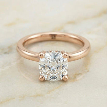 The Lana Secret Halo Adorned Prong Solitaire Cushion Cut Engagement Ring Setting in 14K Rose Gold