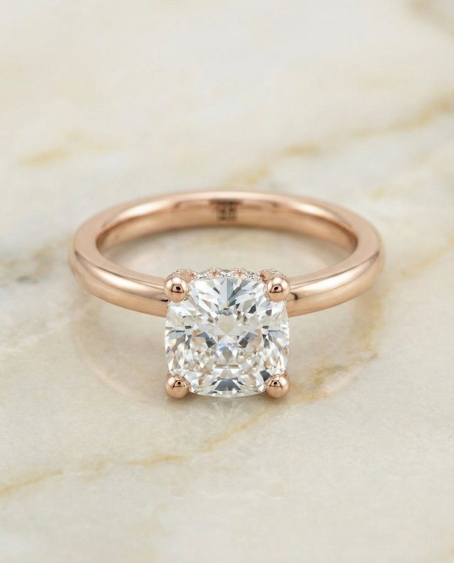 Secret Halo Adorned Prong Solitaire Cushion, in 14K Rose Gold – angled view | RockHer