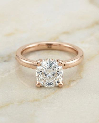 Secret Halo Adorned Prong Solitaire Cushion, in 14K Rose Gold – angled view | RockHer