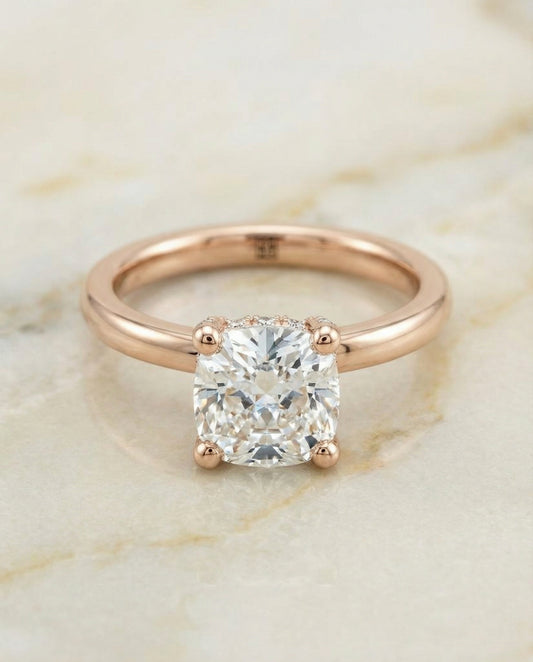 Secret Halo Adorned Prong Solitaire Cushion, in 14K Rose Gold – angled view | RockHer