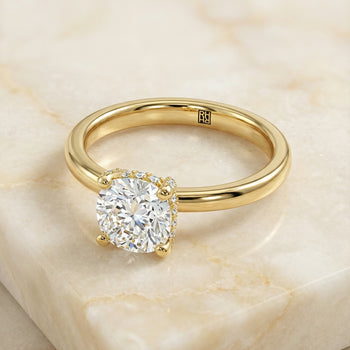 The Lana Secret Halo Adorned Prong Solitaire Cushion Cut Engagement Ring Setting in 18K Yellow Gold