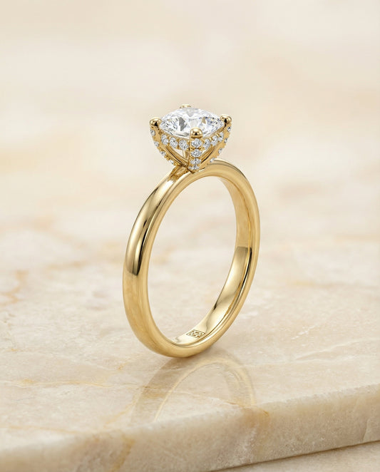Lana Select secret halo adorned prong solitaire cushion ring in 18K Yellow Gold — front — RockHer