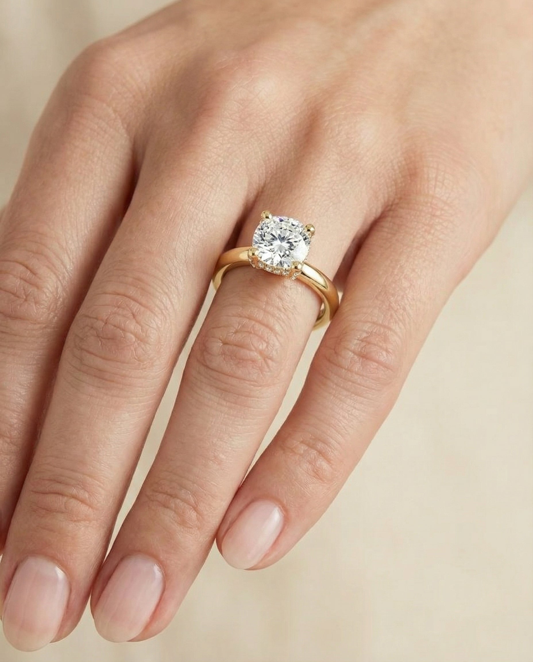 The Lana engagement ring setting in 18K Yellow Gold, secret halo adorned prong solitaire cut design | RockHer