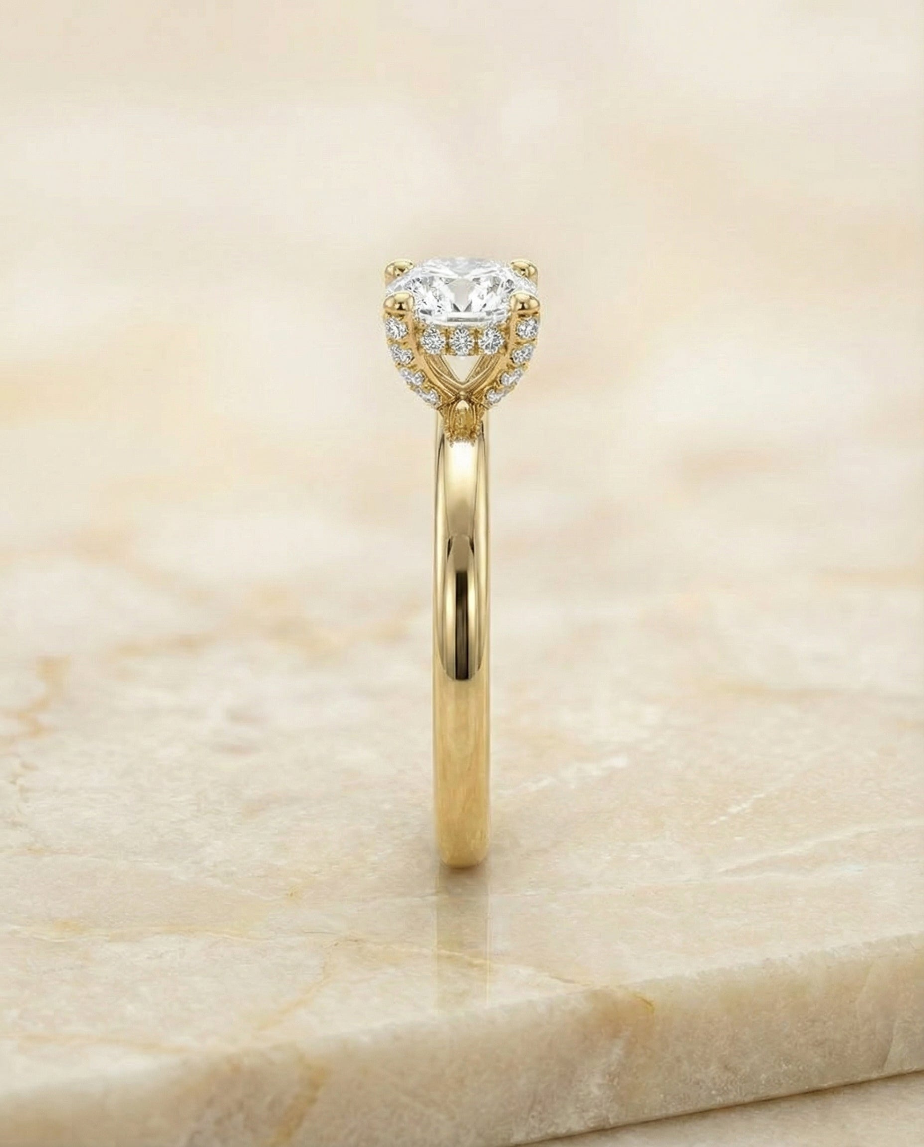 The Lana select secret halo adorned prong solitaire cut engagement ring setting, shown in 18K Yellow Gold | RockHer