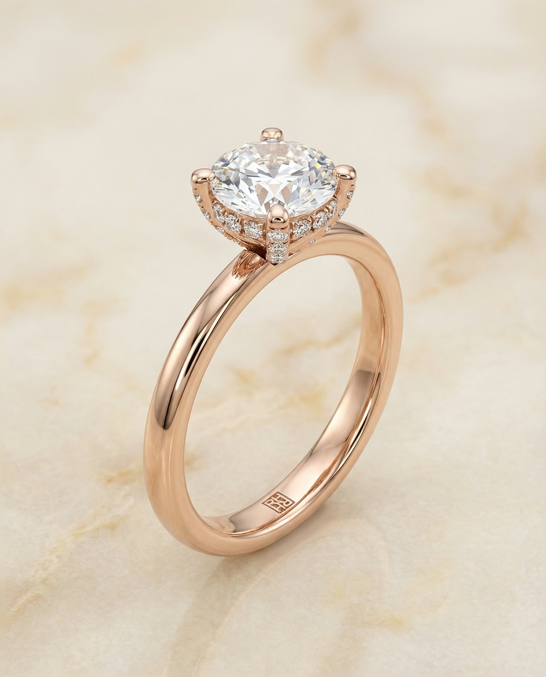 The Lana secret halo adorned prong solitaire engagement ring setting, shown in 14K Rose Gold | RockHer