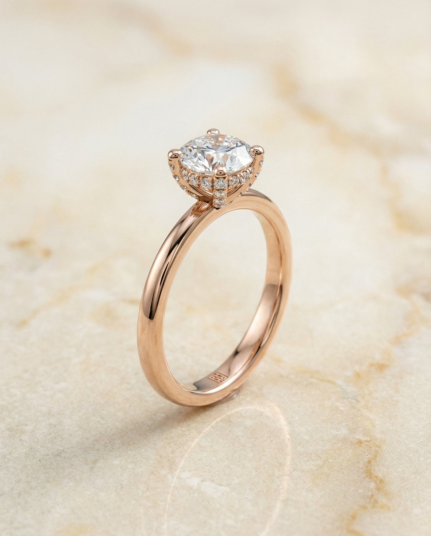 Round Brilliant, Secret Halo Adorned Prong Solitaire, in 14K Rose Gold – front view | RockHer