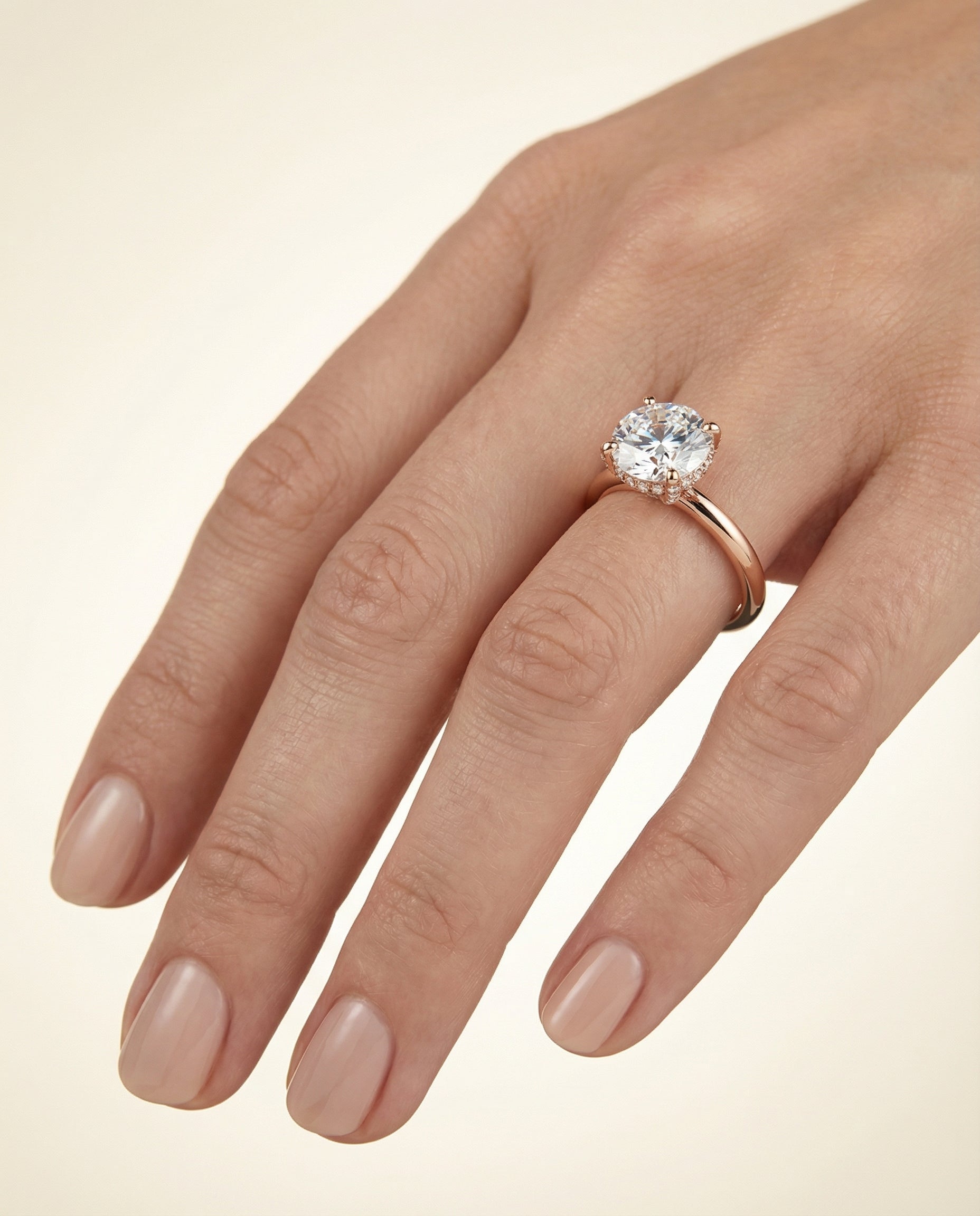 The Lana engagement ring setting in 14K Rose Gold, secret halo adorned prong solitaire design | RockHer