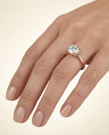 Round Brilliant, Secret Halo Adorned Prong Solitaire, in 14K Rose Gold – lifestyle shot | RockHer