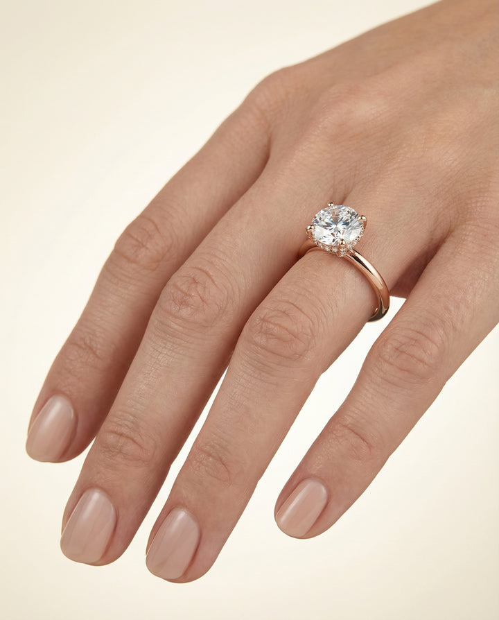 Round Brilliant, Secret Halo Adorned Prong Solitaire, in 14K Rose Gold – lifestyle shot | RockHer