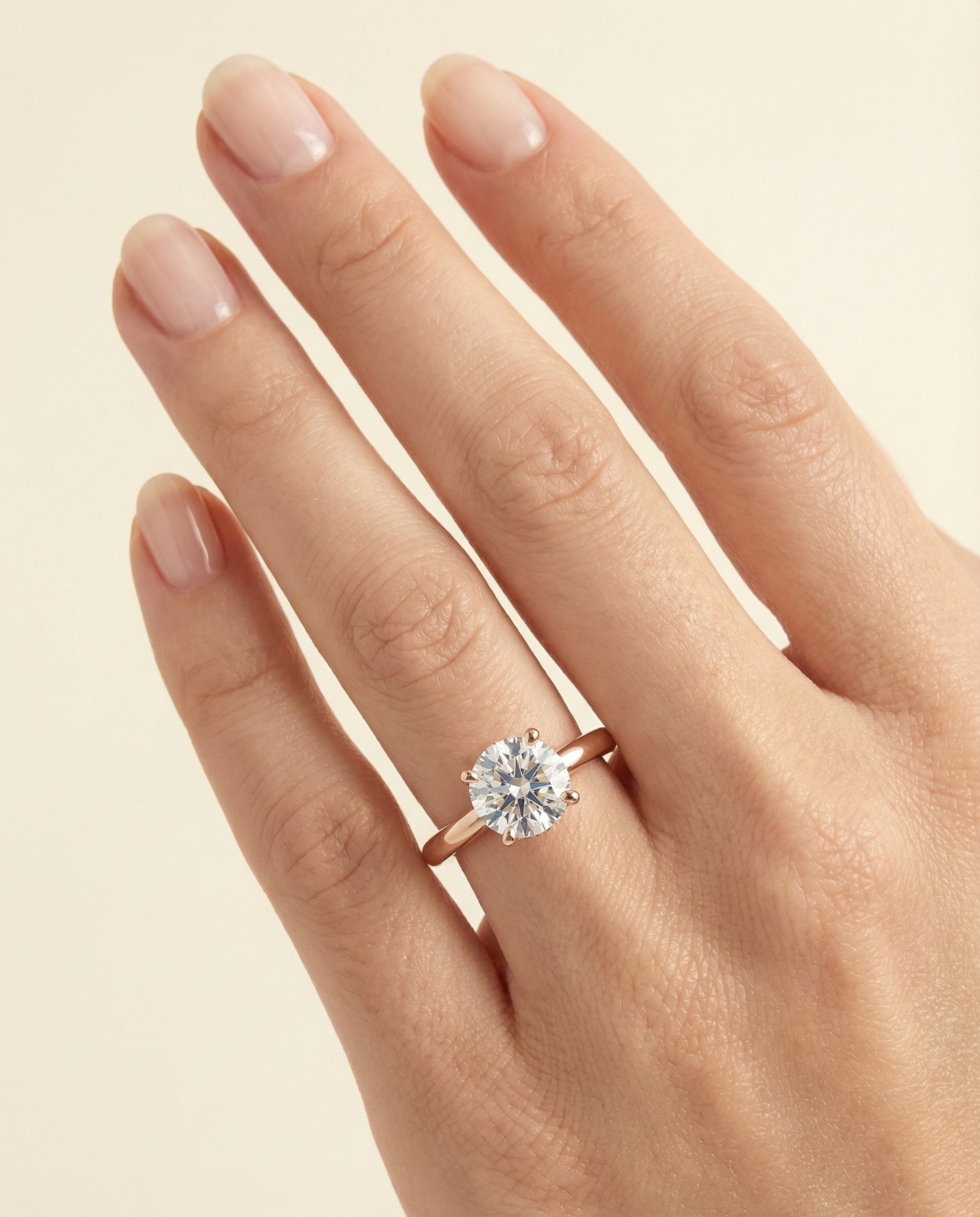 Round Brilliant, Secret Halo Adorned Prong Solitaire, in 14K Rose Gold – lifestyle shot | RockHer