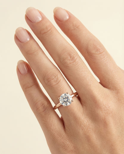 Round Brilliant, Secret Halo Adorned Prong Solitaire, in 14K Rose Gold – lifestyle shot | RockHer