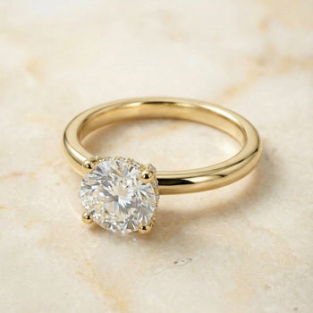 The Lana Secret Halo Adorned Prong Solitaire Round Engagement Ring Setting in 18K Yellow Gold