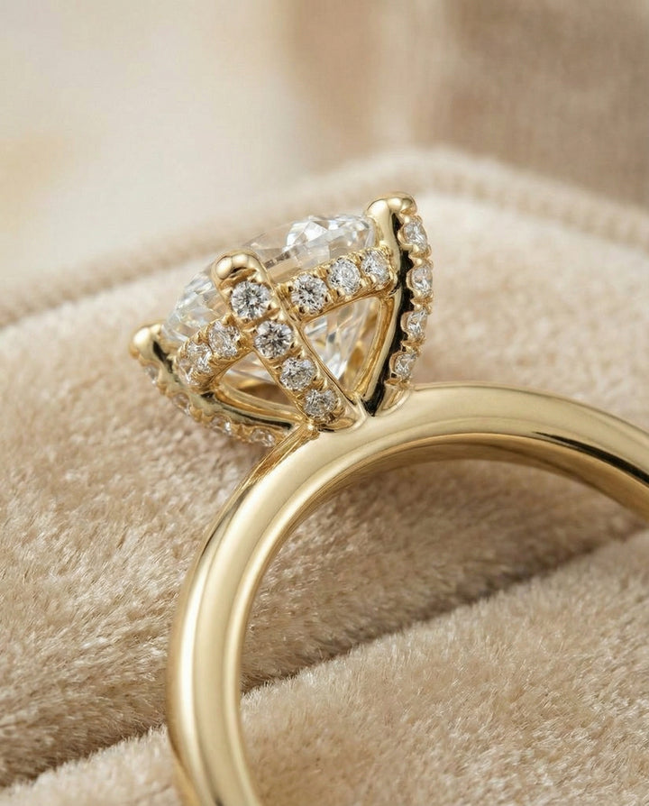 Round Brilliant, Secret Halo Adorned Prong Solitaire, in 18K Yellow Gold – detail view | RockHer