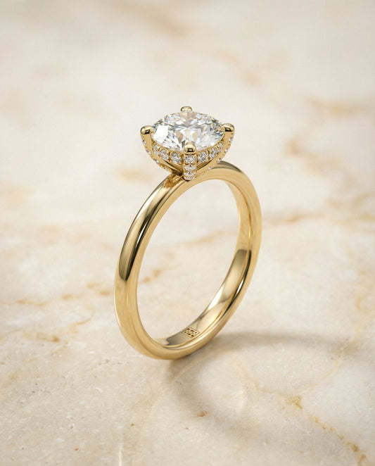 Lana Select secret halo adorned prong solitaire round ring in 14K Yellow Gold — front — RockHer