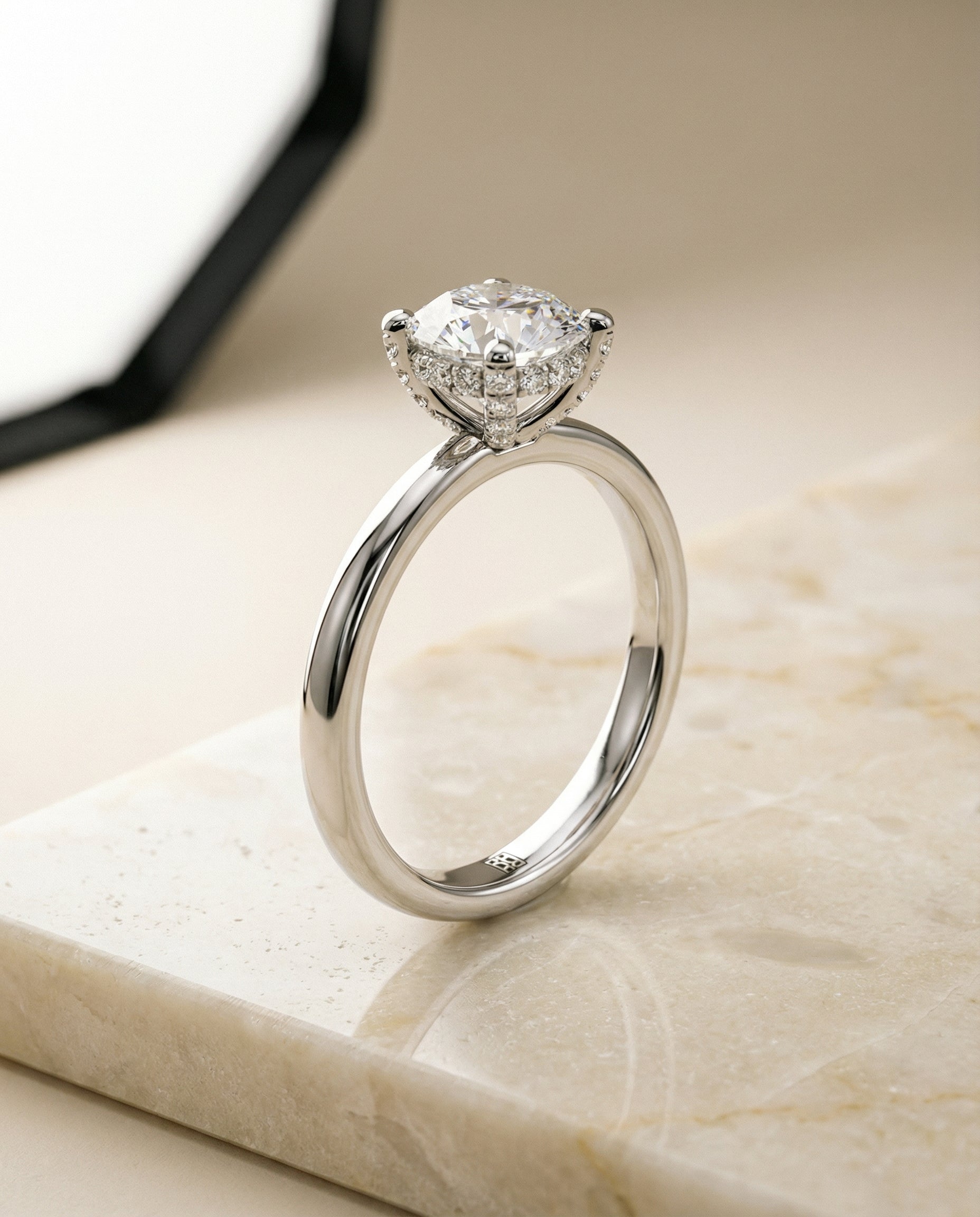The Lana secret halo adorned prong solitaire engagement ring setting, shown in Platinum | RockHer