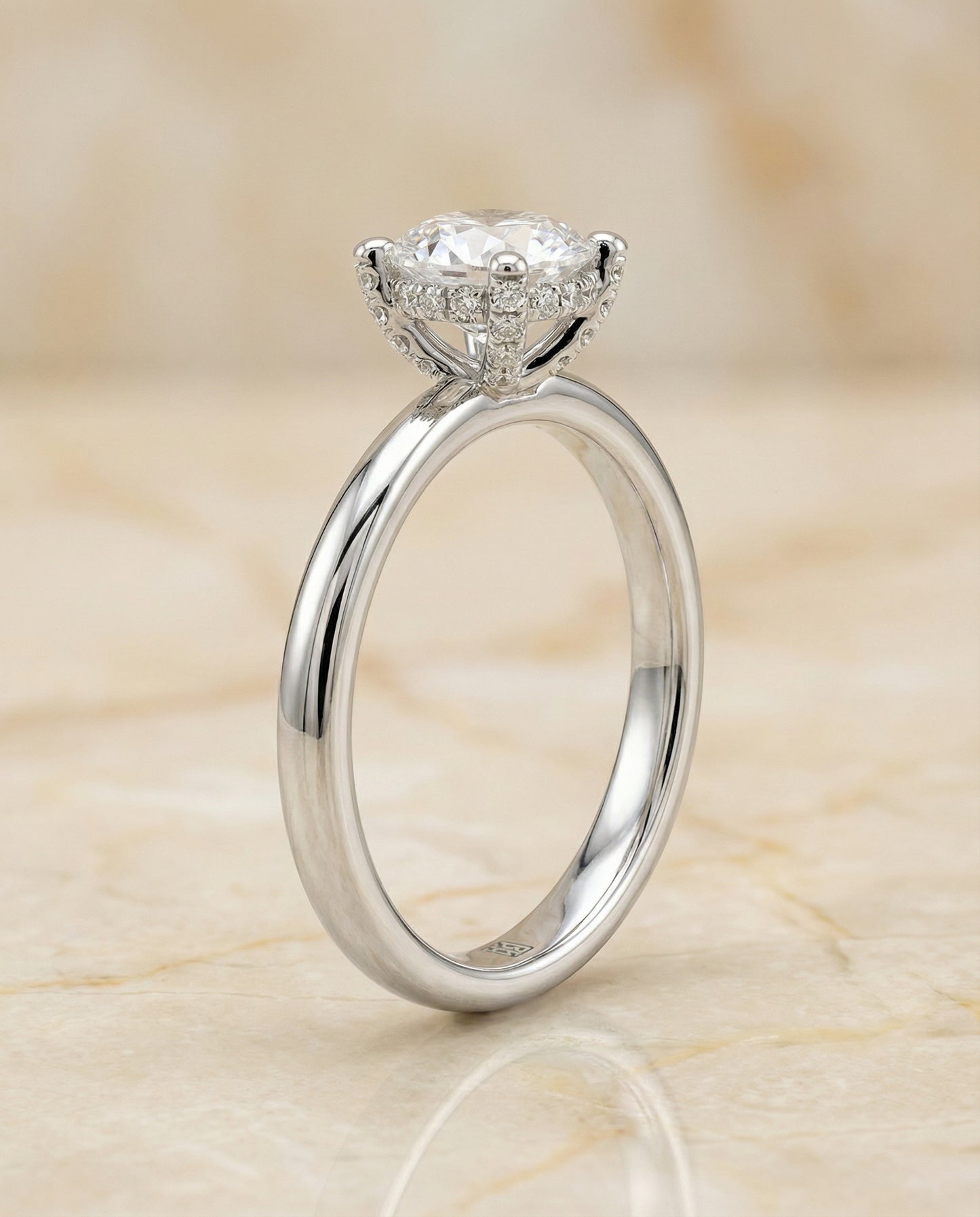 Round Brilliant, Secret Halo Adorned Prong Solitaire, in Platinum – side profile | RockHer