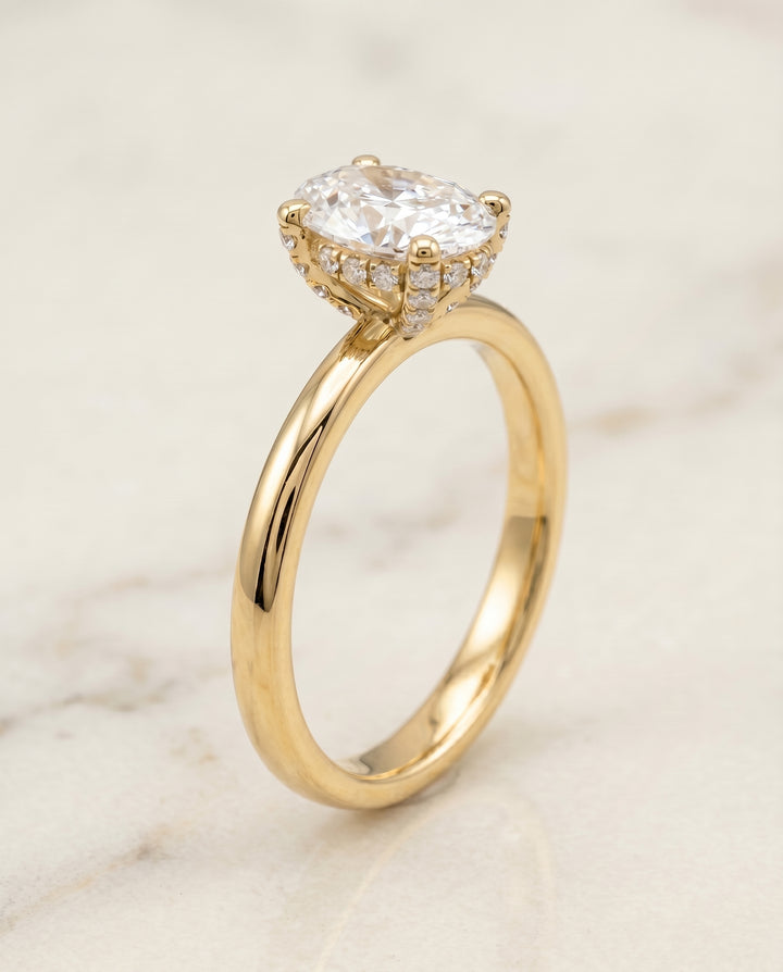 Secret Halo Adorned Prong Solitaire Oval in 18K Yellow Gold