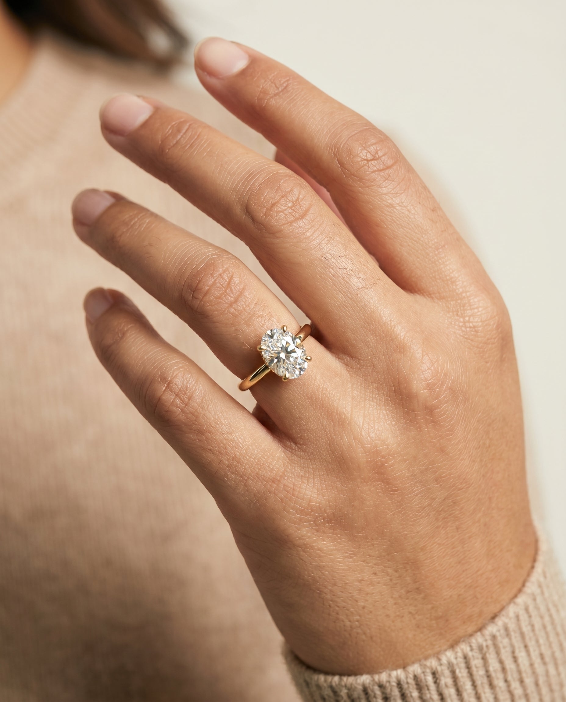 The Lana engagement ring setting in 18K Yellow Gold, secret halo adorned prong solitaire design | RockHer