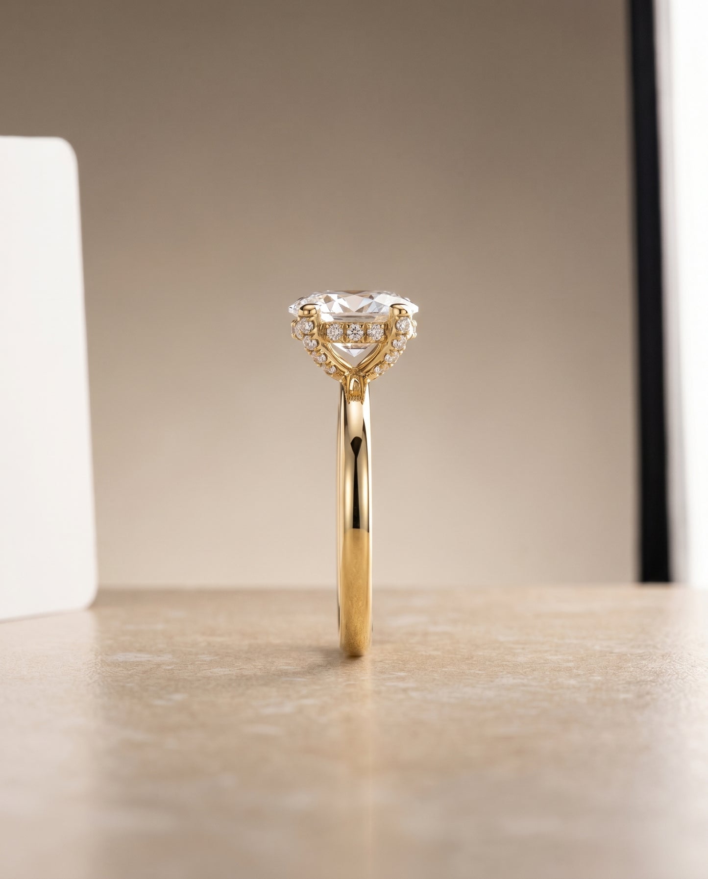 Secret Halo Adorned Prong Solitaire Oval in 18K Yellow Gold