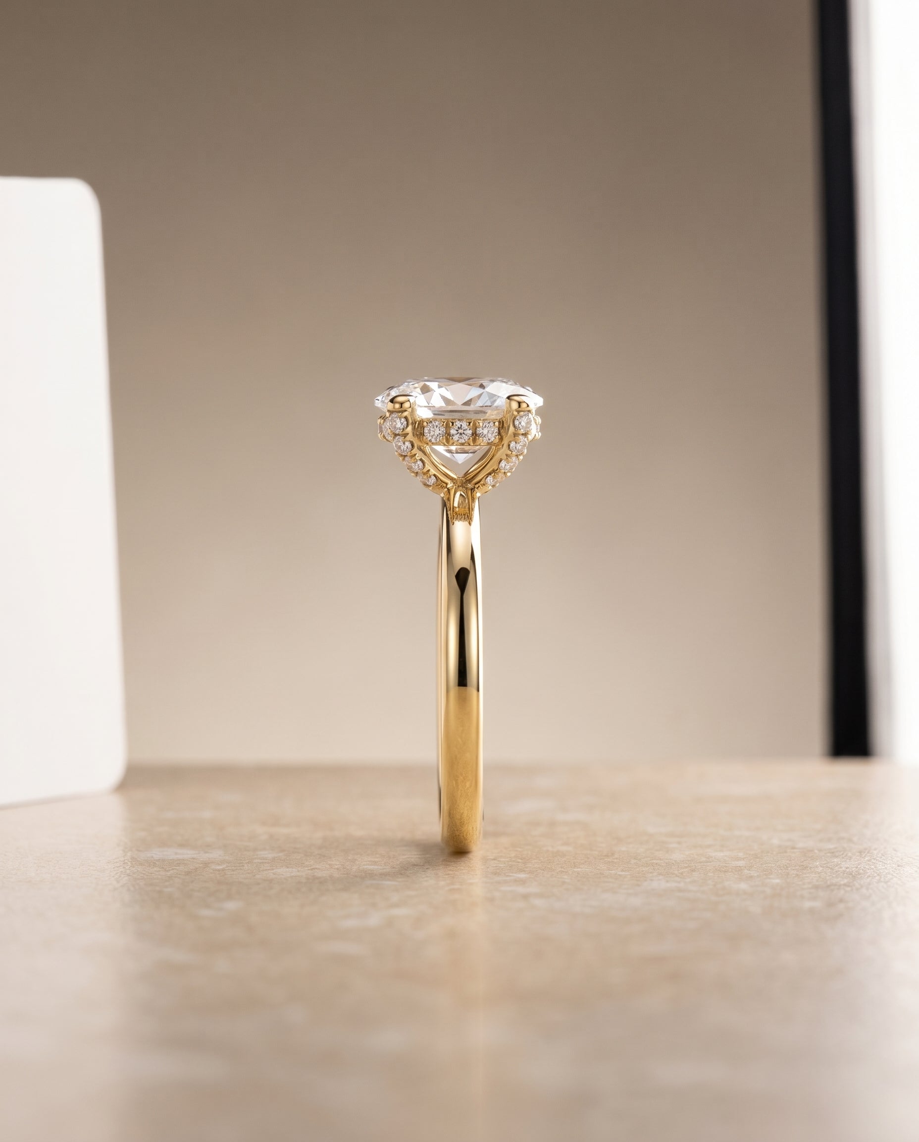 Lana Select Secret Halo Adorned Prong Solitaire Oval Lab Diamond Engagement Ring in 18K Yellow Gold, side view | RockHer
