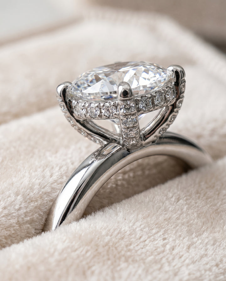The Lana Secret Halo Adorned Prong Solitaire Oval Engagement Ring Setting in 18K White Gold