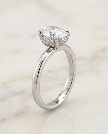 The Lana Secret Halo Adorned Prong Solitaire Oval Engagement Ring Setting in Platinum