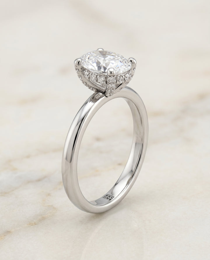 The Lana Secret Halo Adorned Prong Solitaire Oval Engagement Ring Setting in 18K White Gold