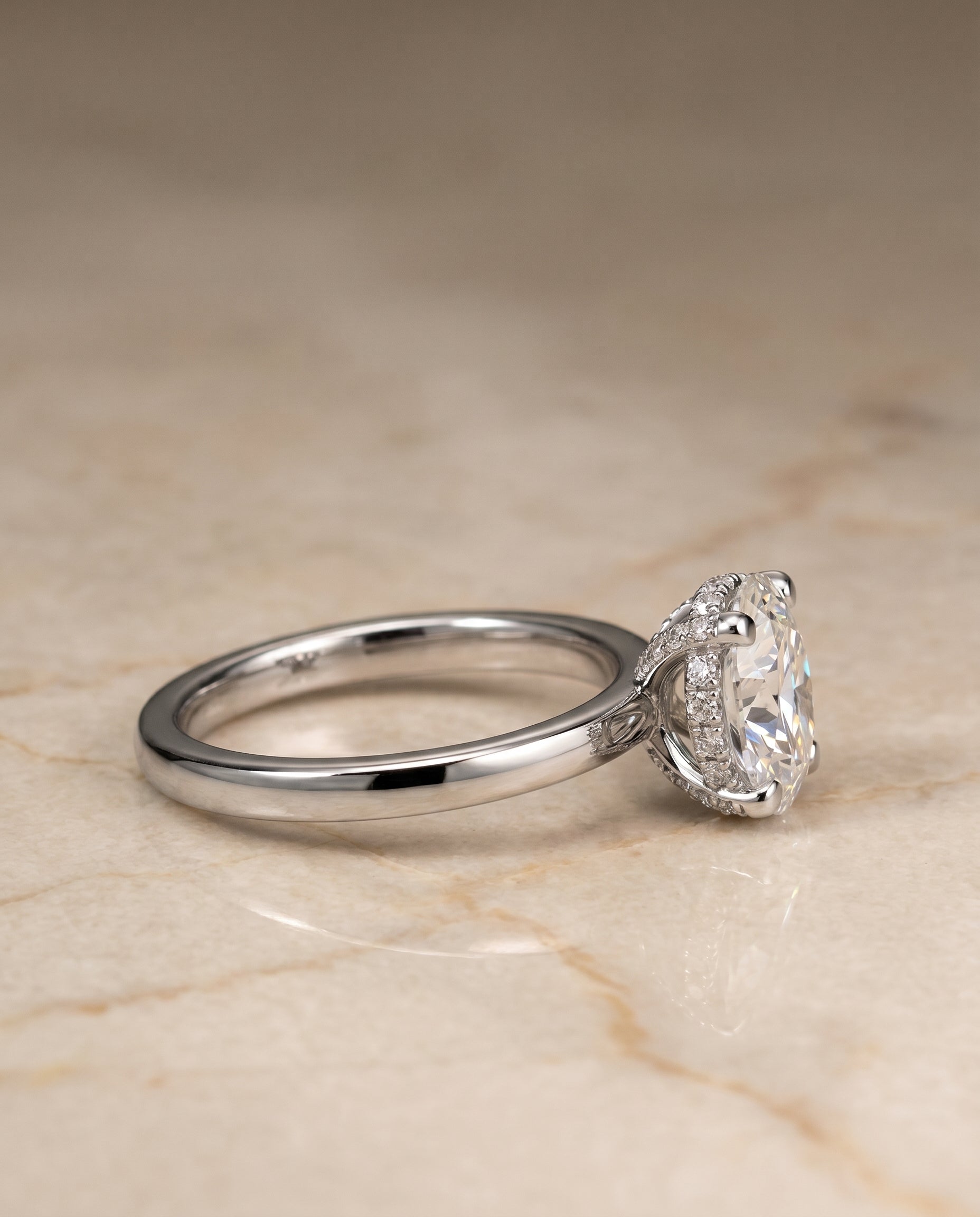 Lana Select Secret Halo Adorned Prong Solitaire Oval Lab Diamond Engagement Ring in 18K White Gold, side view | RockHer