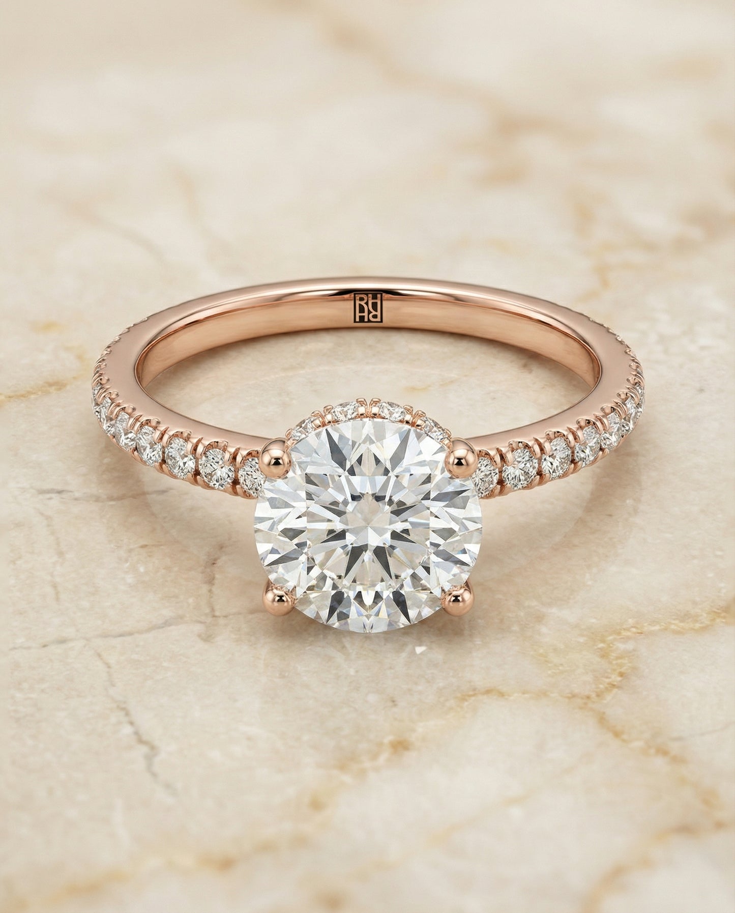 Round Brilliant, Secret Halo French Pavé Solitaire, in 14K Rose Gold, prong setting – angled view | RockHer