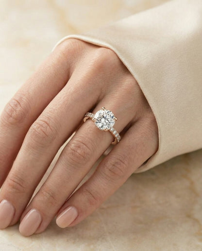 Round Brilliant, Secret Halo French Pavé Solitaire, in 14K Rose Gold, prong setting – lifestyle shot | RockHer