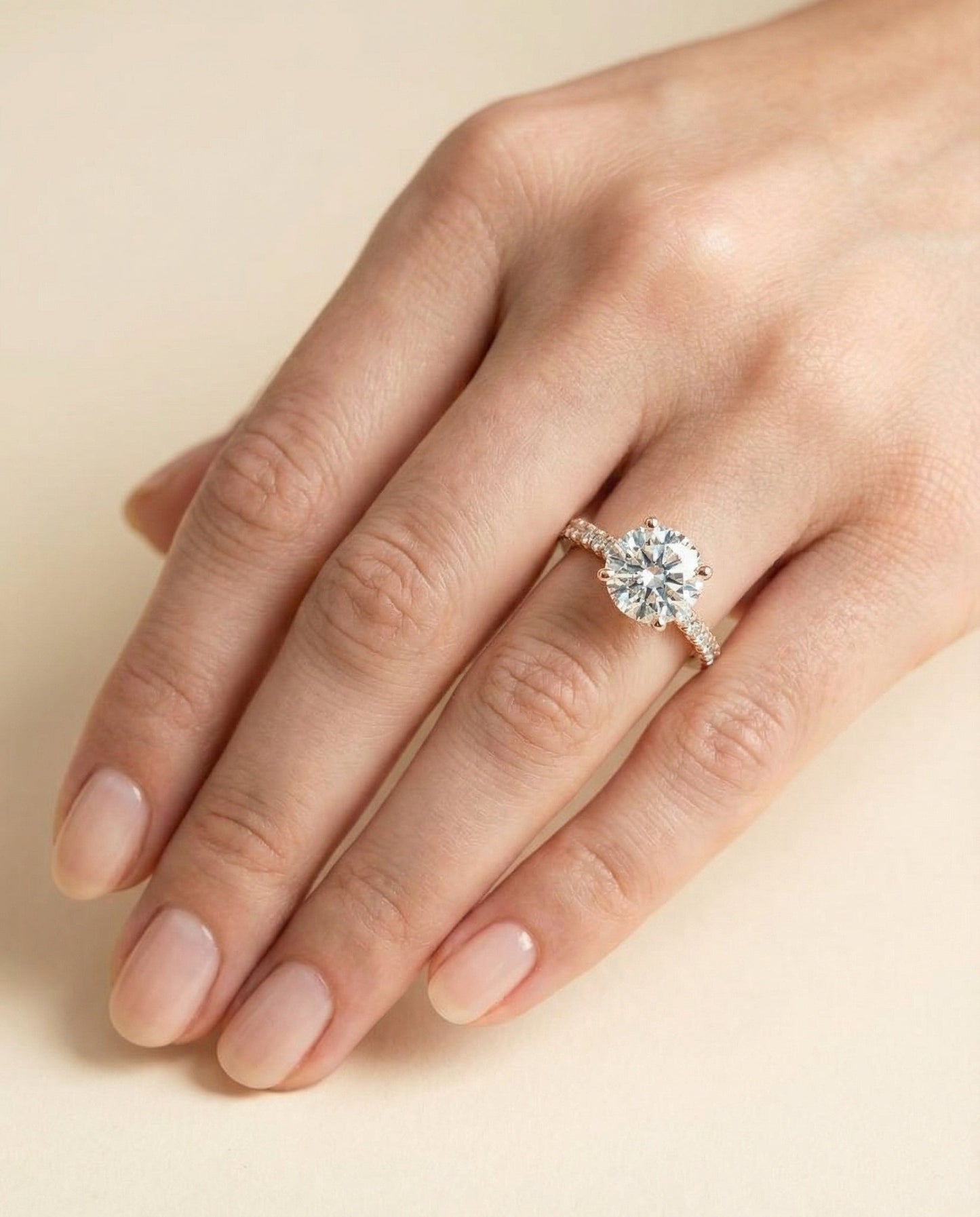 Elliott Select Hidden Halo Pavé Round Lab Diamond Engagement Ring in 14K Rose Gold, shown on hand | RockHer