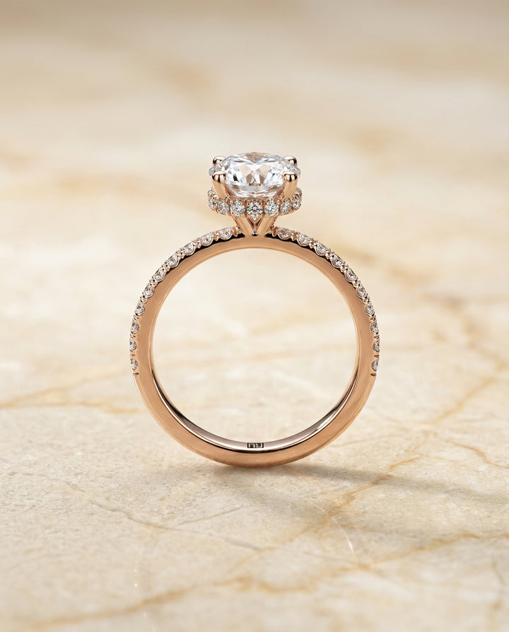 Round Brilliant, Secret Halo French Pavé Solitaire, in 14K Rose Gold, prong setting – side profile | RockHer