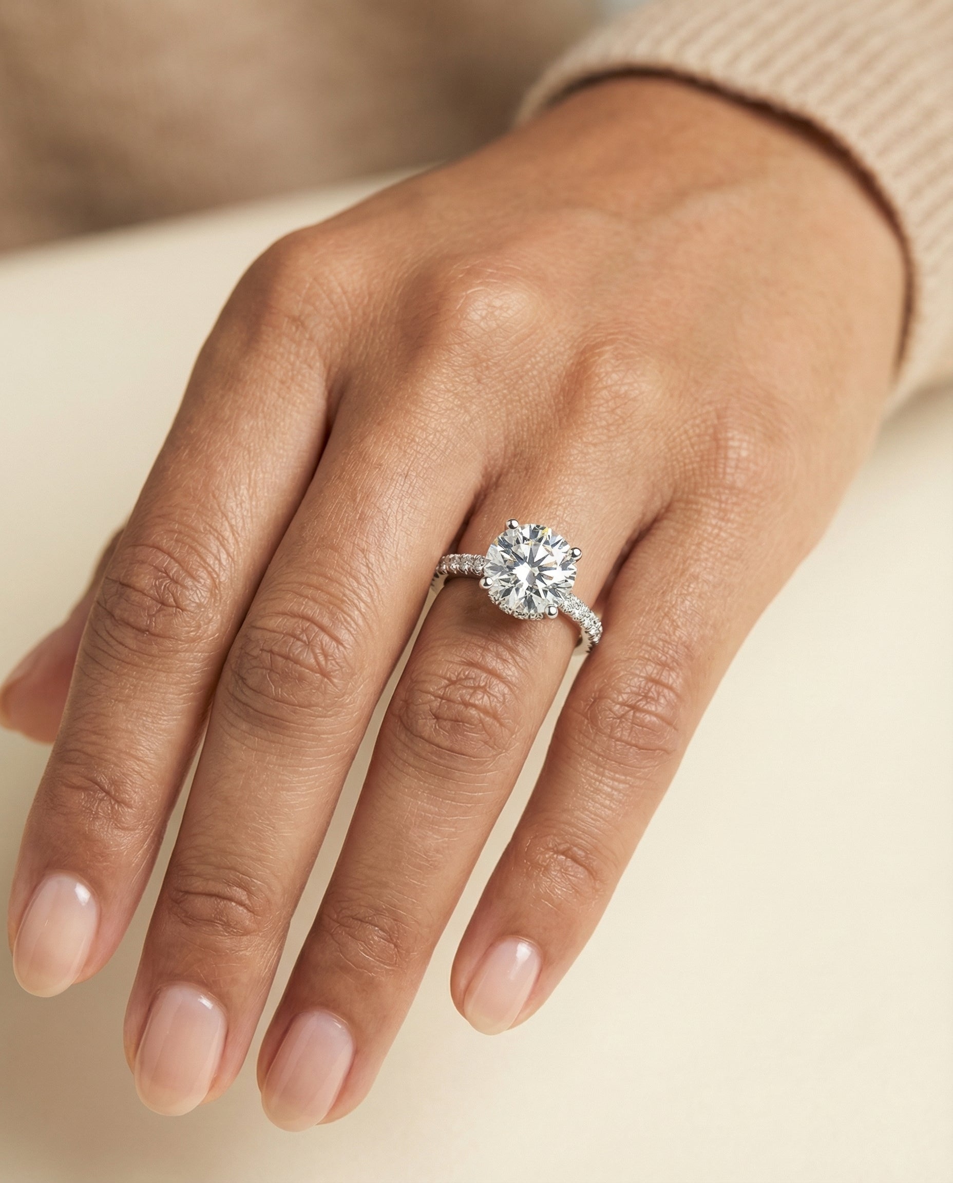 Elliott Select Hidden Halo Pavé Round Lab Diamond Engagement Ring in Platinum, shown on hand | RockHer
