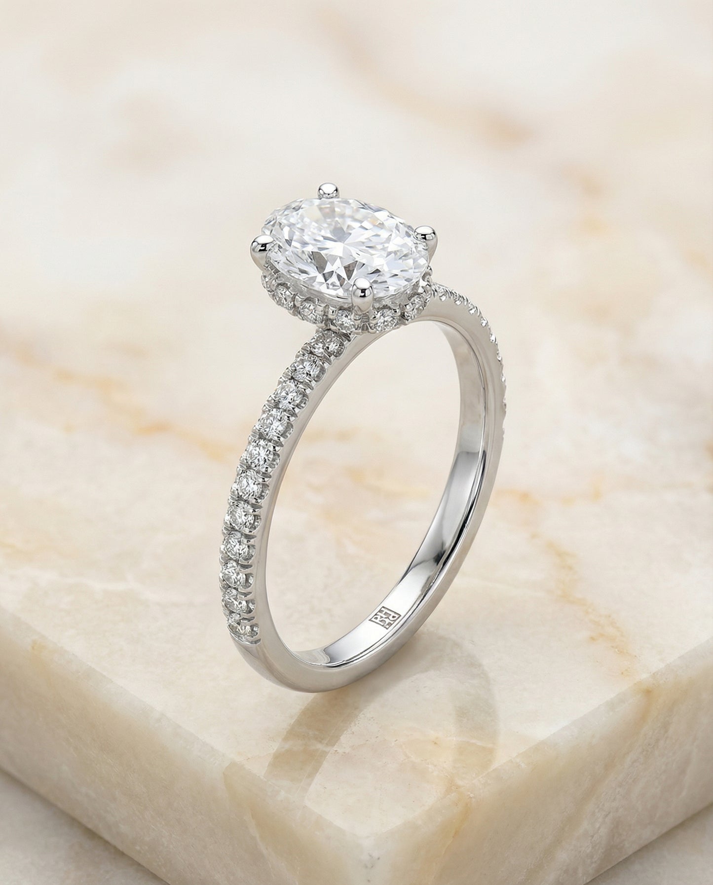 Secret Halo French Pavé Solitaire Oval, in Platinum – angled view | RockHer