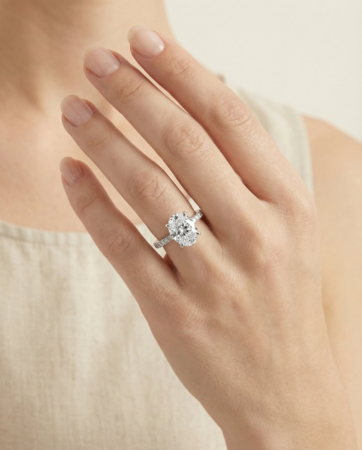 The Elliott — Secret Halo French Pavé Solitaire Oval in 14K White Gold