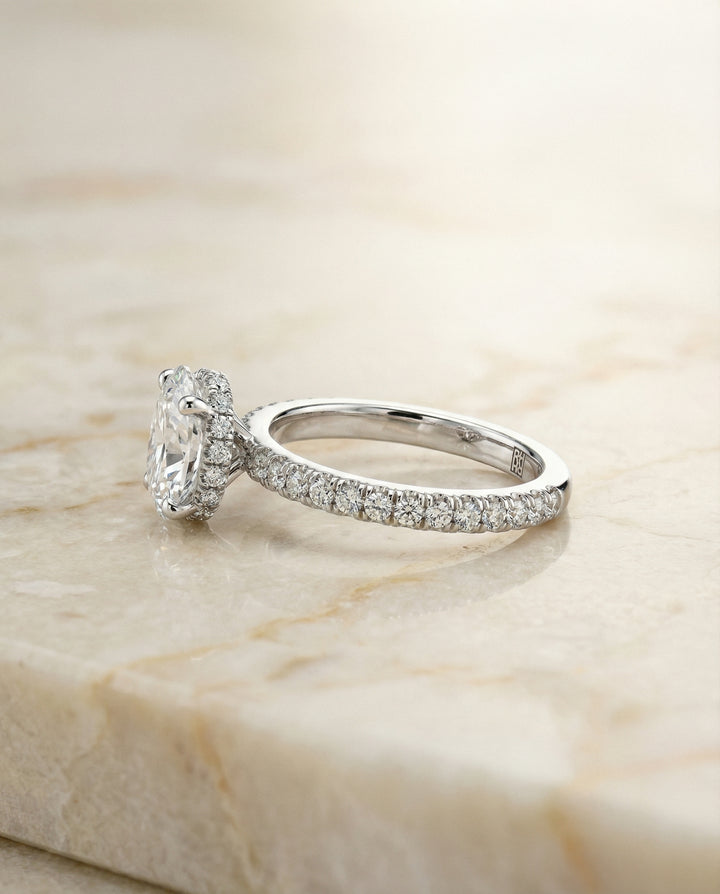 Secret Halo French Pavé Solitaire Oval, in Platinum – side profile | RockHer