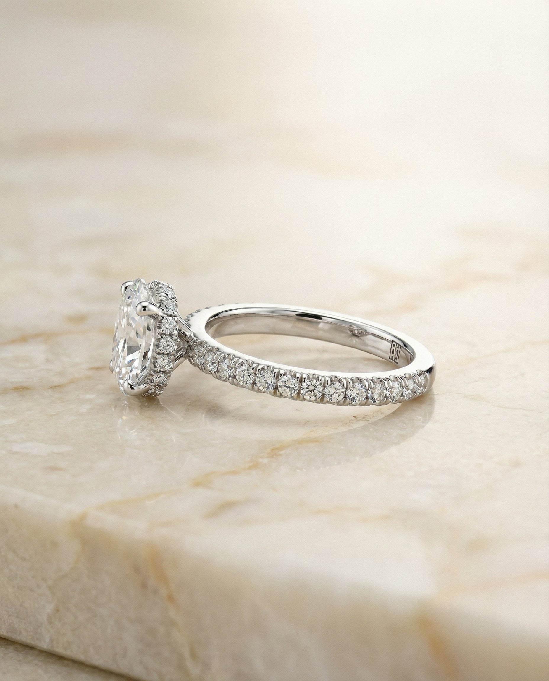 Elliott Select Hidden Halo Pavé Oval Lab Diamond Engagement Ring in Platinum, side view | RockHer