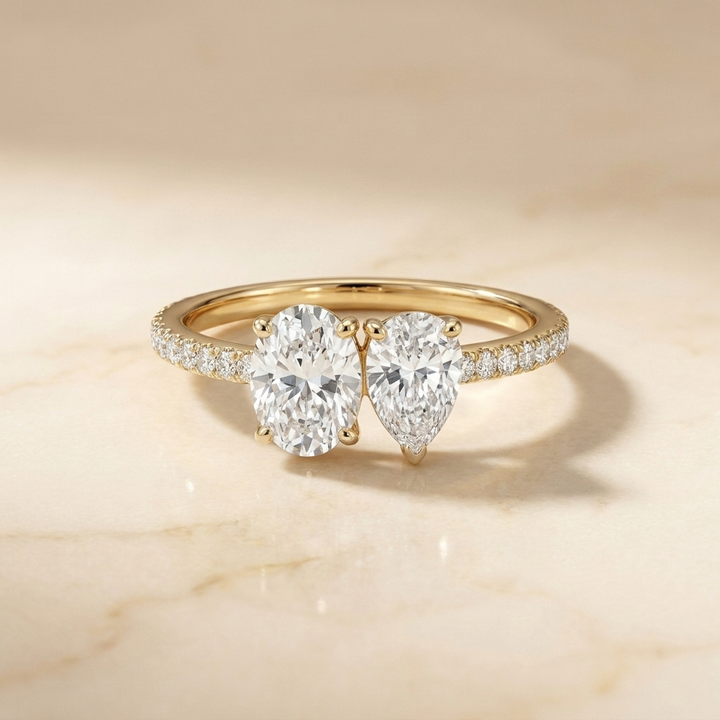 14K Yellow Gold Selena Select Toi et Moi Oval & Pear Pavé Band Lab Diamond Engagement Ring - Hero on warm marble