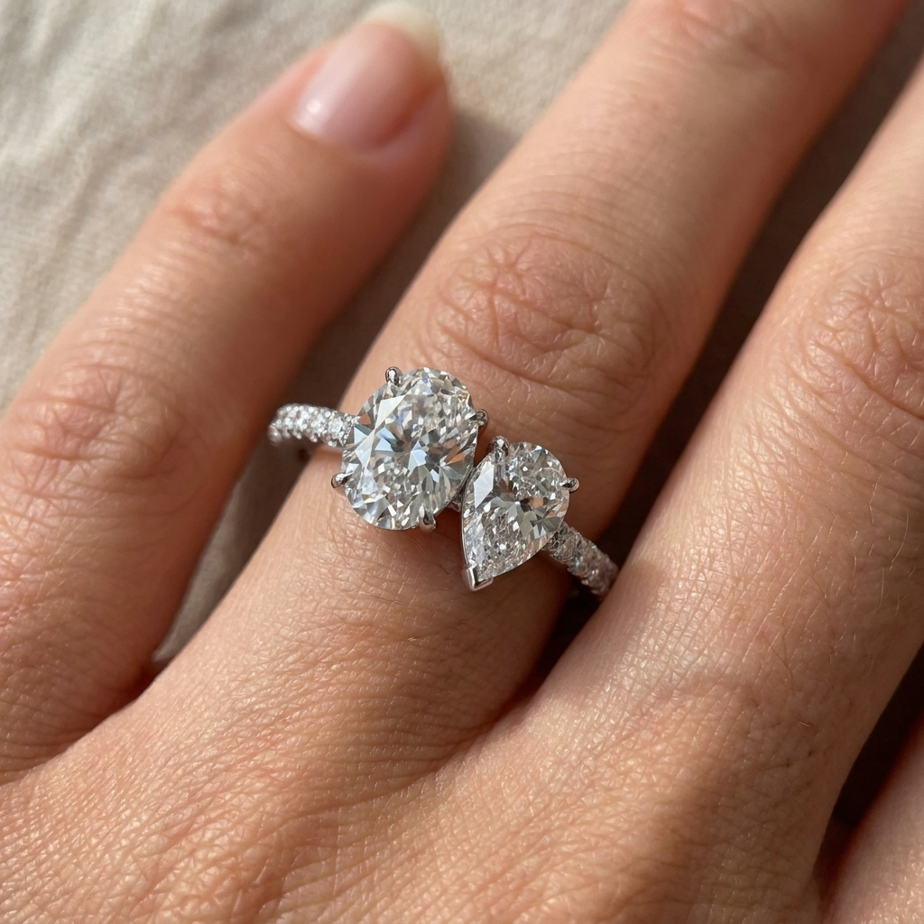 18K White Gold Selena Select Toi et Moi Oval & Pear Pavé Band Lab Diamond Engagement Ring - Macro close-up on finger