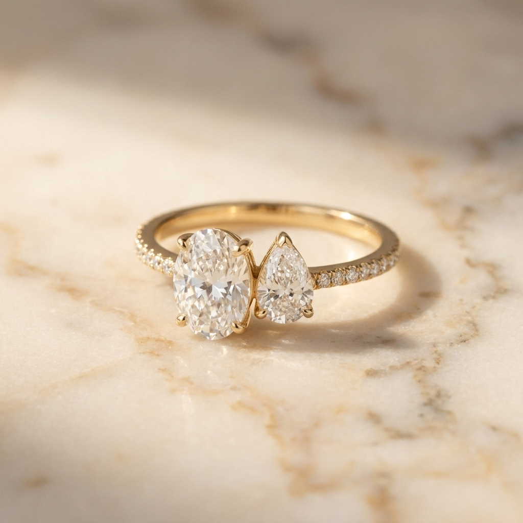 18K Yellow Gold Selena Select Toi et Moi Oval & Pear Pavé Band Lab Diamond Engagement Ring - Hero on warm marble