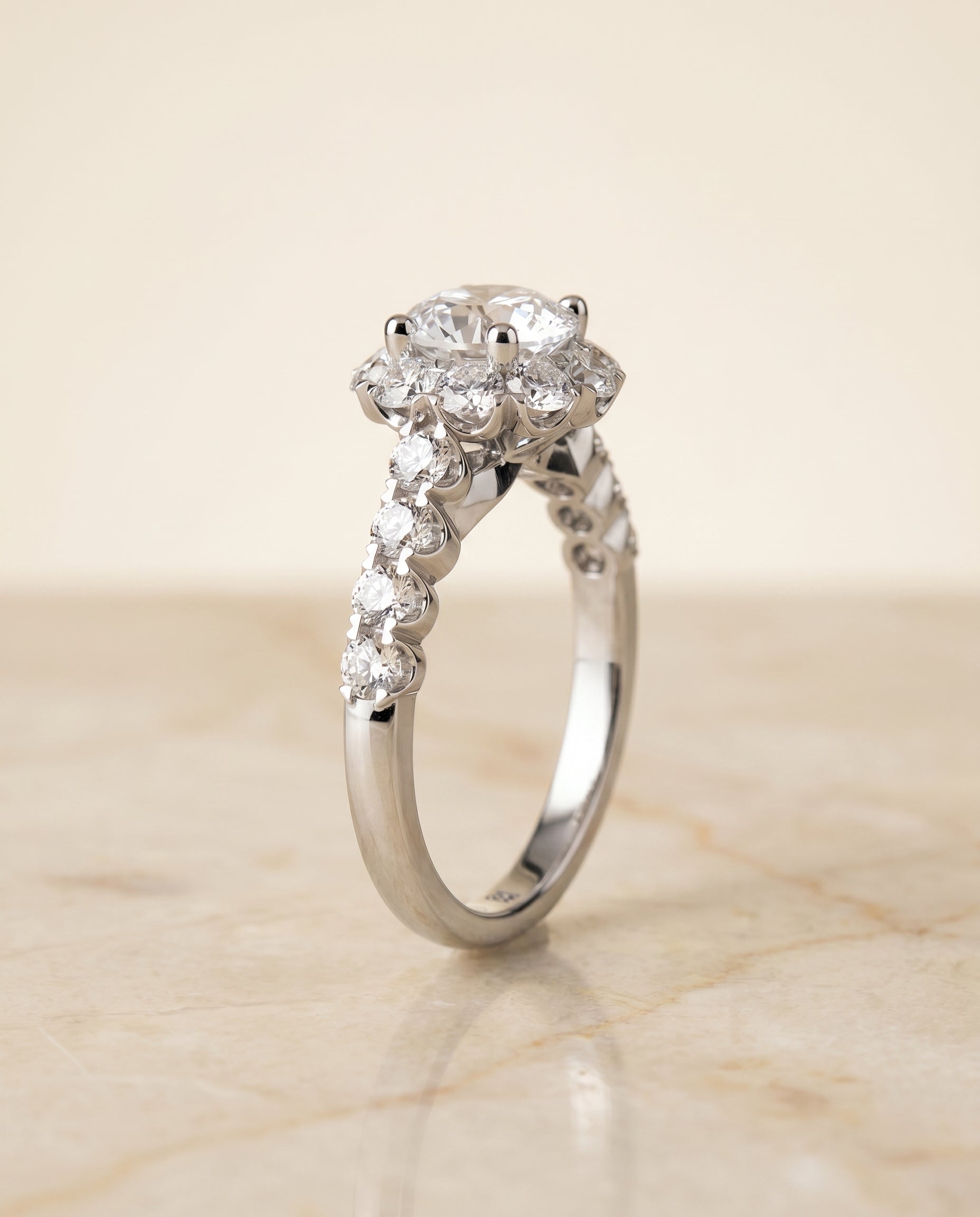 The Musetta shared prong halo linear band engagement ring setting, shown in 18K White Gold | RockHer