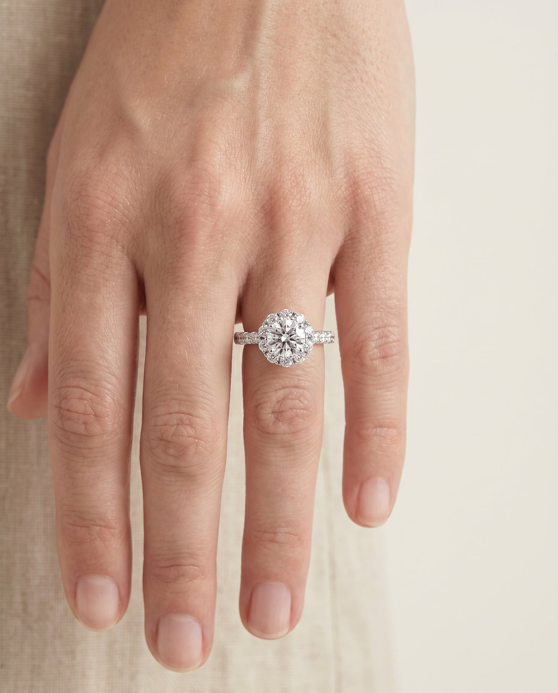 The Musetta engagement ring setting in 18K White Gold, shared prong halo linear band design | RockHer