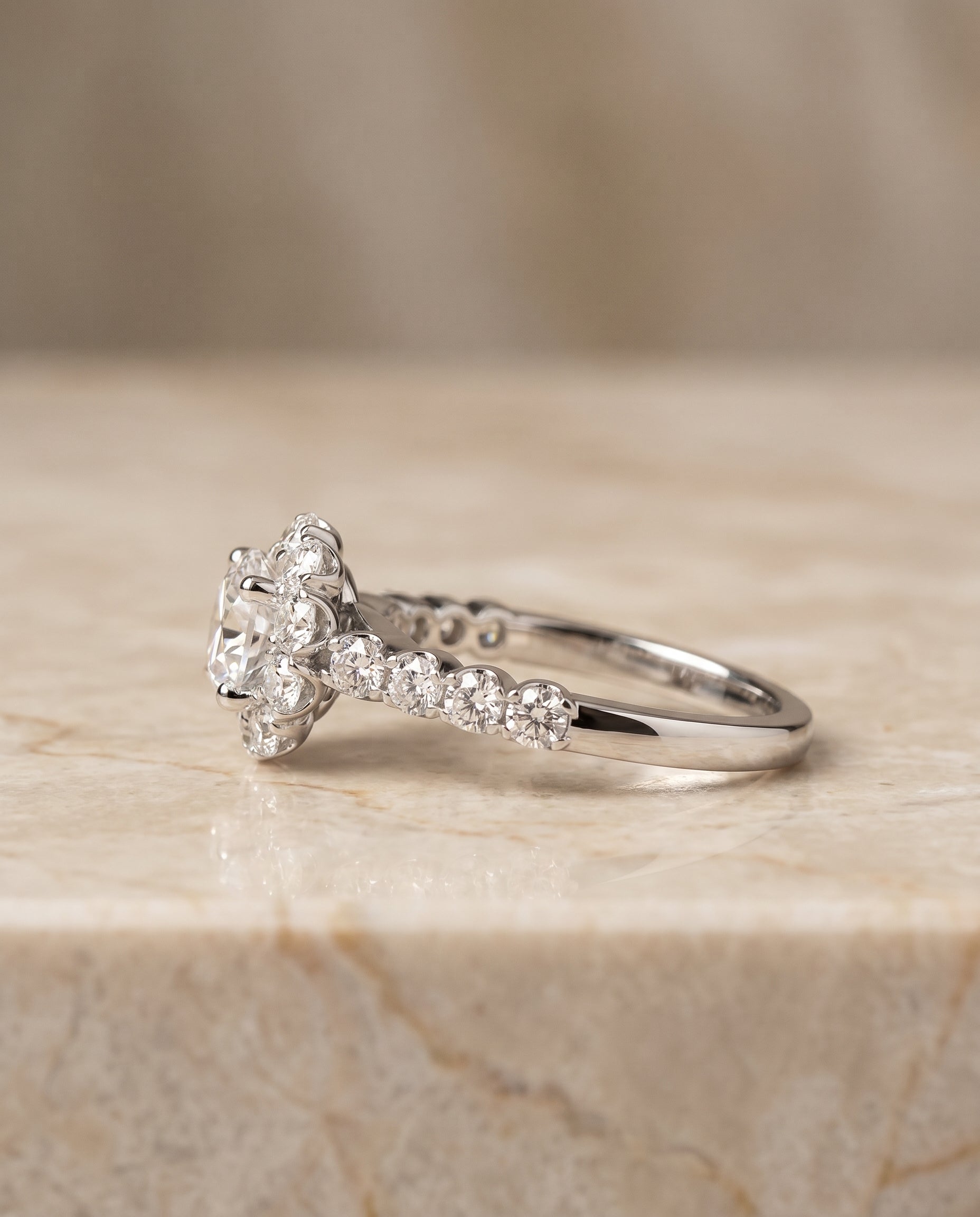 Shared Prong Halo Linear Band styling on The Musetta round engagement ring setting | RockHer