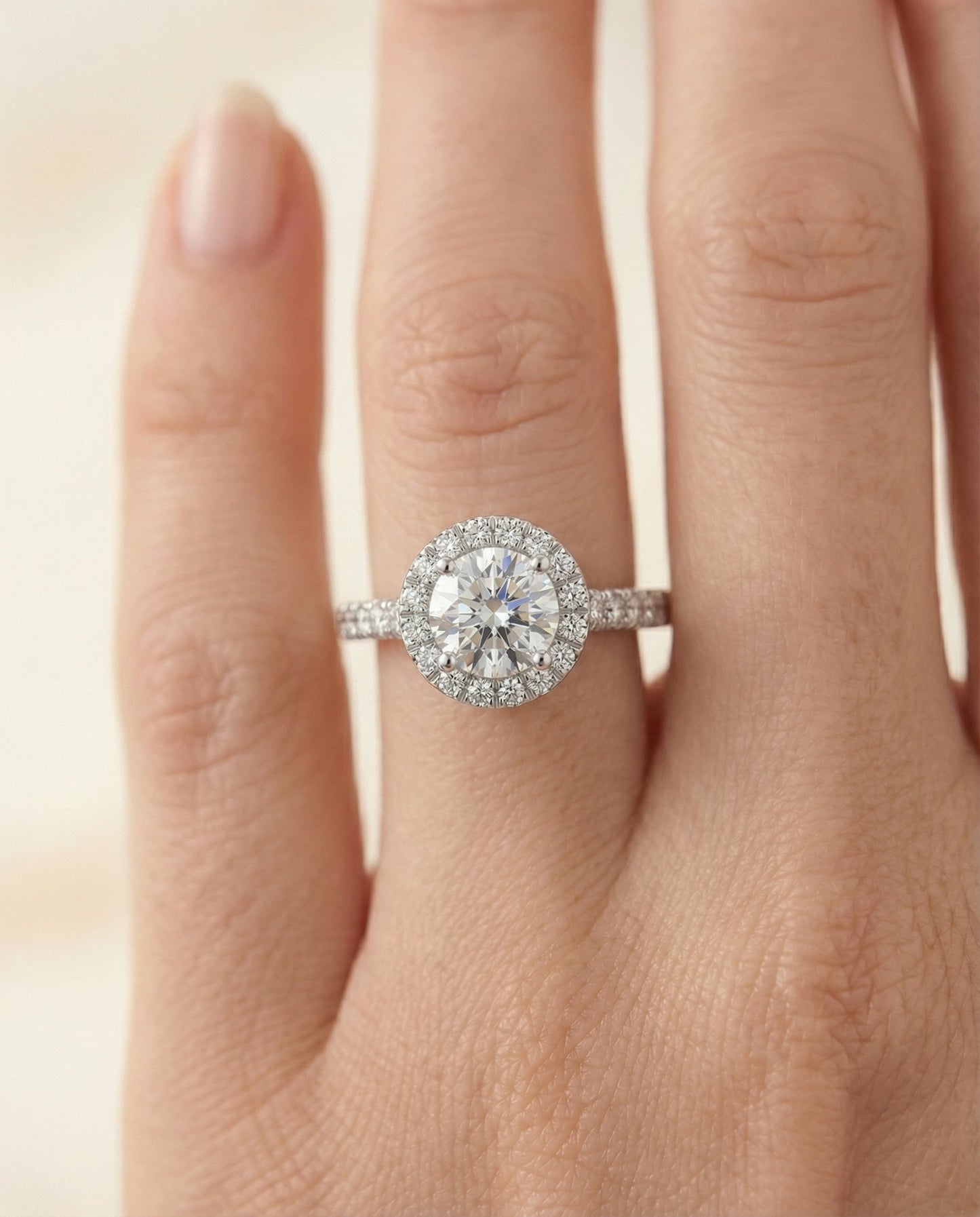 Lucille Select shared prong halo linear side set round ring in 14K White Gold — front — RockHer