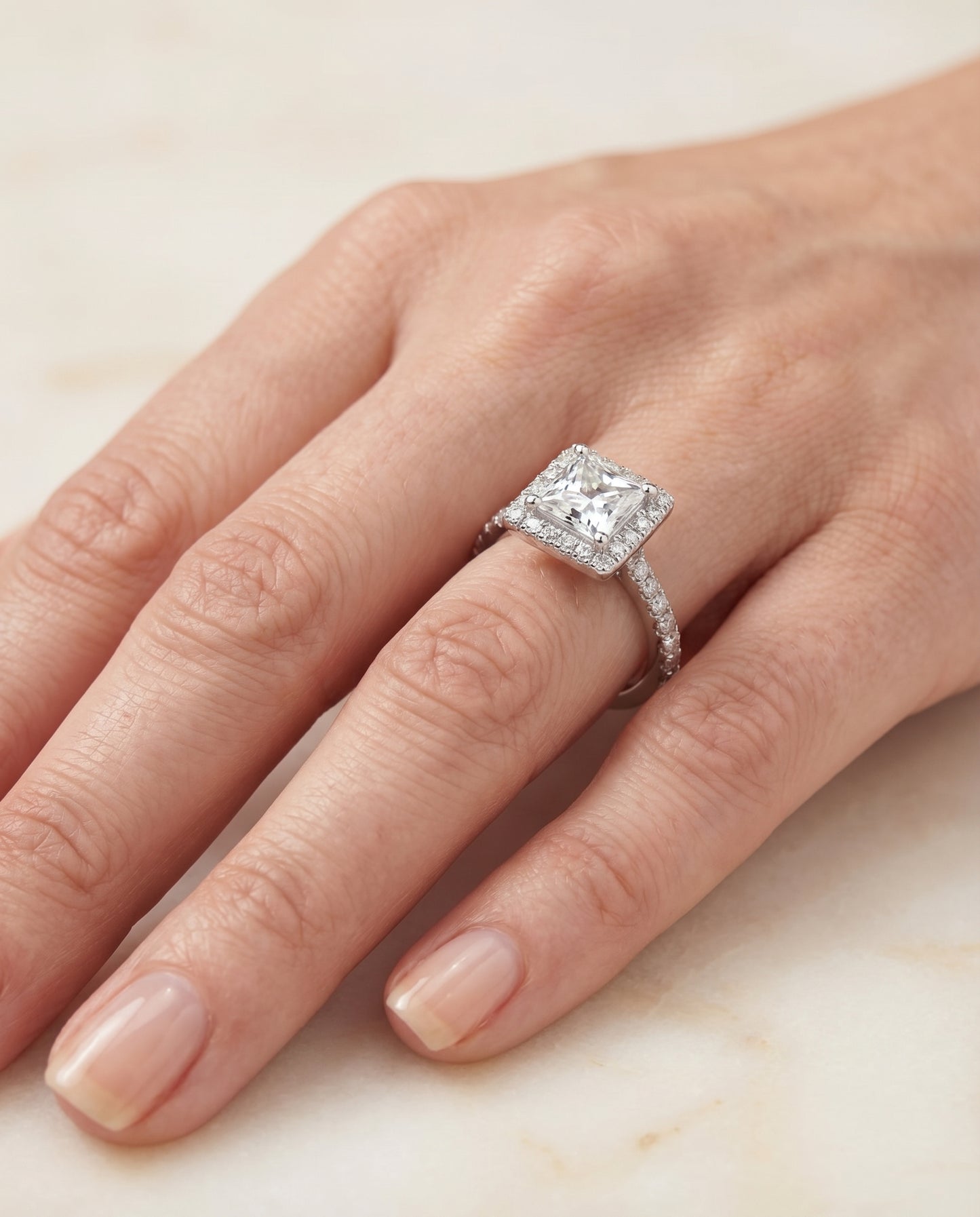 Shared Prong Pavé Halo Princess, in Platinum, pave setting – lifestyle shot | RockHer