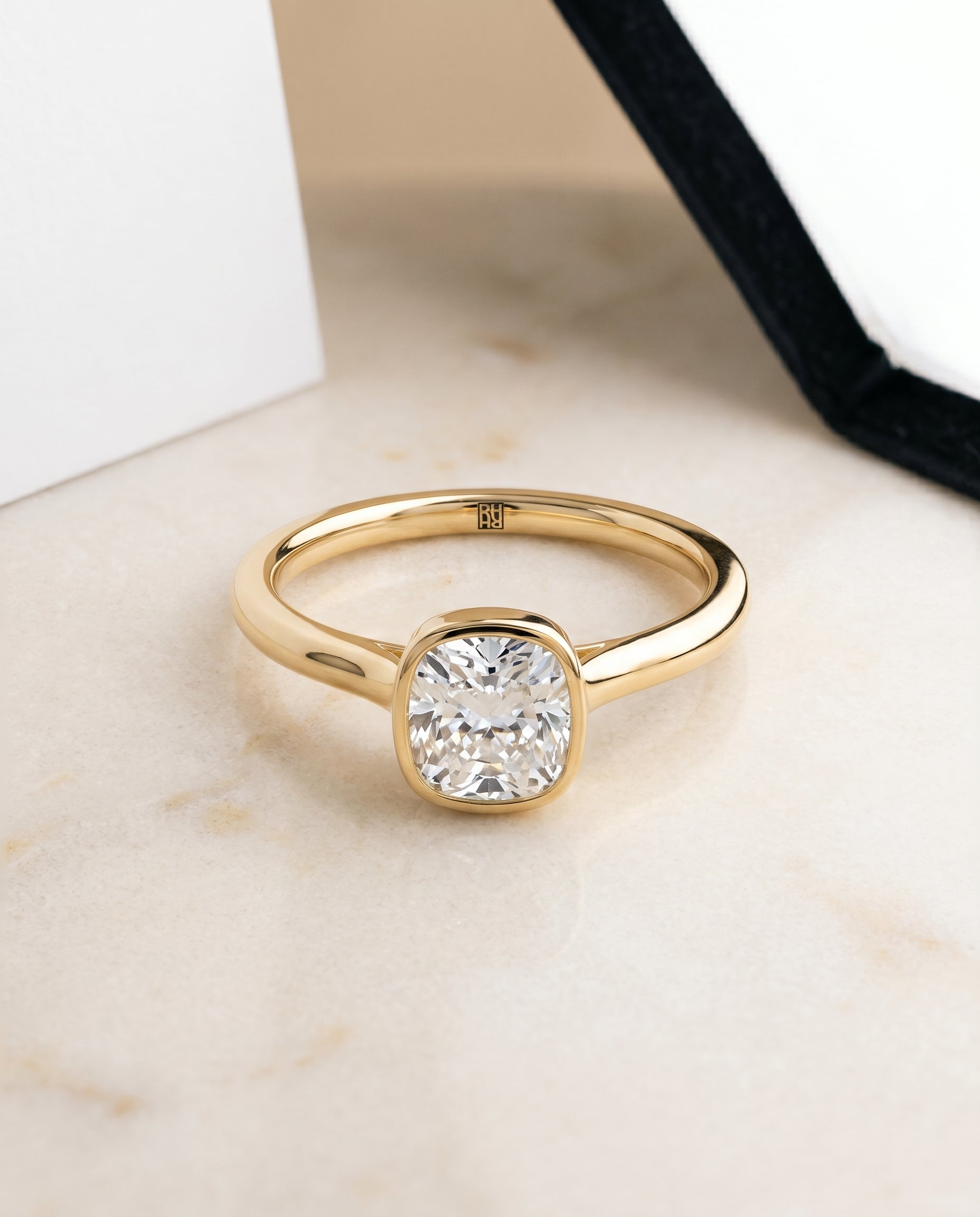 The Duran Bezel Solitaire Engagement Ring Setting for Cushion Diamonds in 18K Yellow Gold | RockHer