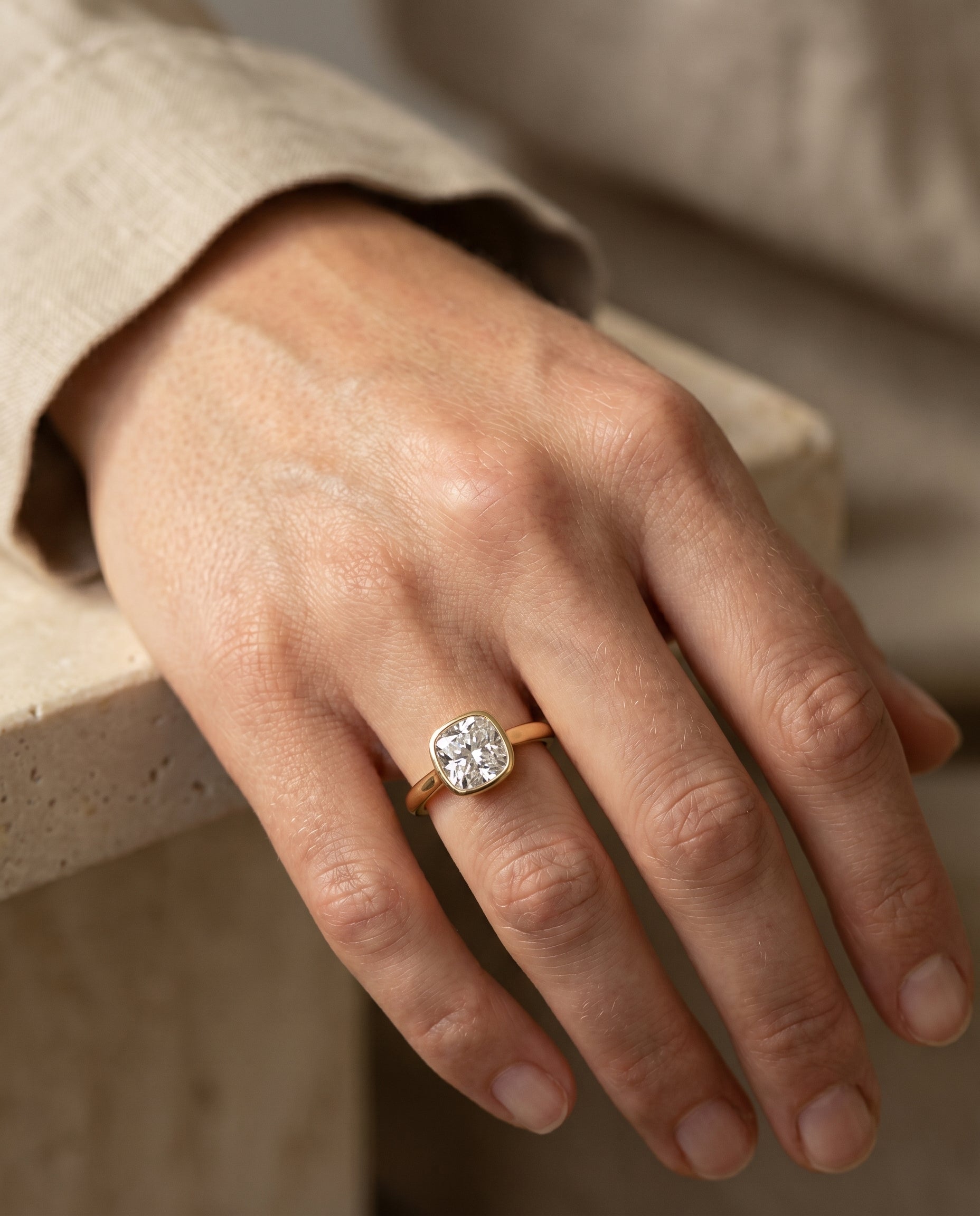 The Duran engagement ring setting in 18K Yellow Gold, select simple bezel solitaire cut design | RockHer